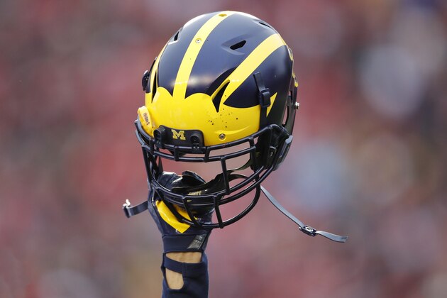 MADISON, WI - NOVEMBER 18: General view as a Michigan Wolverines helmet is held in the air during a game against the Wisconsin Badgers at Camp Randall Stadium on November 18, 2017 in Madison, Wisconsin. Wisconsin won 24-10. (Photo by Joe Robbins/Getty Images) *** Local Caption ***