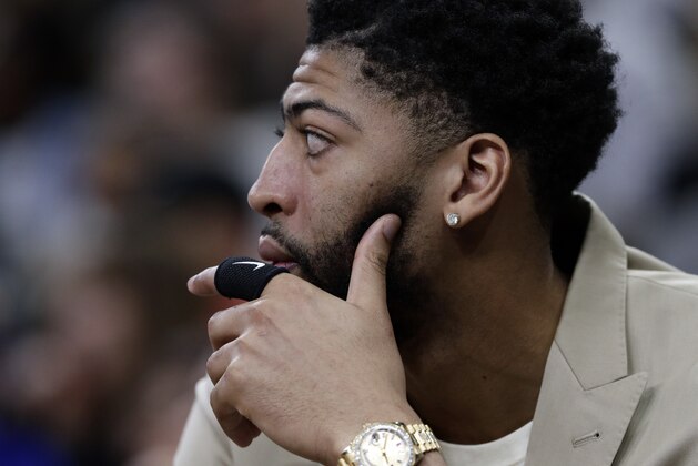 New Orleans Pelicans forward Anthony Davis, who is out with a left index finger sprain, sits on the bench during the second half of the team's NBA basketball game against the San Antonio Spurs in San Antonio, Saturday, Feb. 2, 2019. (AP Photo/Eric Gay)