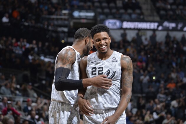 SAN ANTONIO, TX - FEBRUARY 2: LaMarcus Aldridge #12 of the San Antonio Spurs smiles with Rudy Gay #22 of the San Antonio Spurs during the game against the New Orleans Pelicans on February 2, 2019 at the AT&T Center in San Antonio, Texas. NOTE TO USER: User expressly acknowledges and agrees that, by downloading and or using this photograph, user is consenting to the terms and conditions of the Getty Images License Agreement. Mandatory Copyright Notice: Copyright 2019 NBAE (Photos by Mark Sobhani/NBAE via Getty Images)