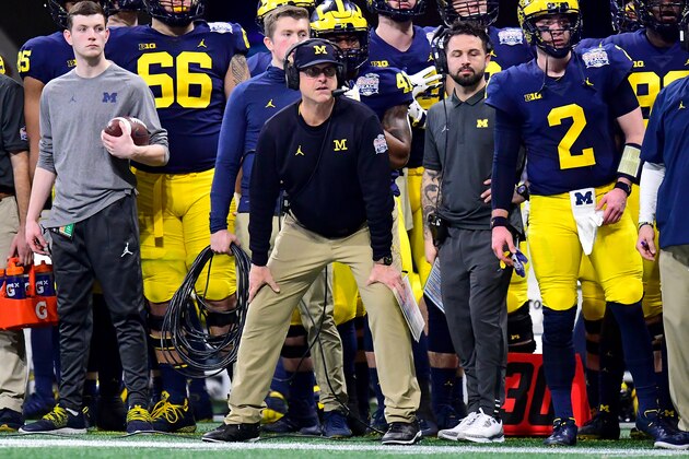 ATLANTA, GEORGIA - DECEMBER 29:  Head coach Jim Harbaugh of the Michigan Wolverines looks on in the first quarter against the Florida Gators during the Chick-fil-A Peach Bowl at Mercedes-Benz Stadium on December 29, 2018 in Atlanta, Georgia. (Photo by Scott Cunningham/Getty Images)