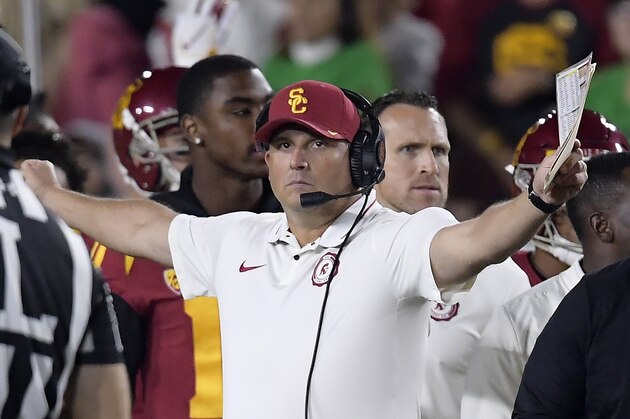 Southern California head coach Clay Helton gestures during the first half of an NCAA college football game against Notre Dame Saturday, Nov. 24, 2018, in Los Angeles. (AP Photo/Mark J. Terrill) Southern California head coach Clay Helton gestures during the first half of an NCAA college football game against Notre Dame Saturday, Nov. 24, 2018, in Los Angeles. (AP Photo/Mark J. Terrill)