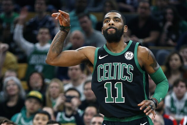 Boston Celtics' Kyrie Irving reacts after making a three-pointer during the first half of an NBA basketball game against the Oklahoma City Thunder in Boston, Sunday, Feb. 3, 2019. (AP Photo/Michael Dwyer)