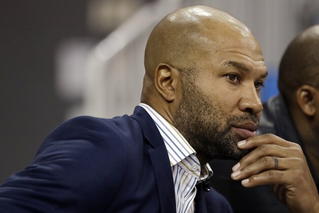 Derek Fisher, head coach of the WNBA Los Angeles Sparks, watches an NCAA college basketball game between UCLA and Oregon Sunday, Jan. 13, 2019, in Los Angeles. (AP Photo/Marcio Jose Sanchez)