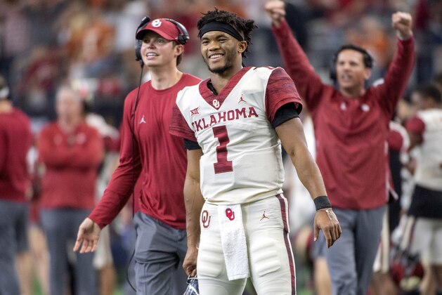 FILE - In this Dec. 1, 2018, file photo, Oklahoma quarterback Kyler Murray (1) celebrates on the sidelines after throwing a touchdown against Oklahoma during the second half of the Big 12 Conference championship NCAA college football game, in Arlington, Texas. Murray was named The Associated Press college football Player of the Year, Thursday, Dec. 6, 2018. (AP Photo/Jeffrey McWhorter, File)