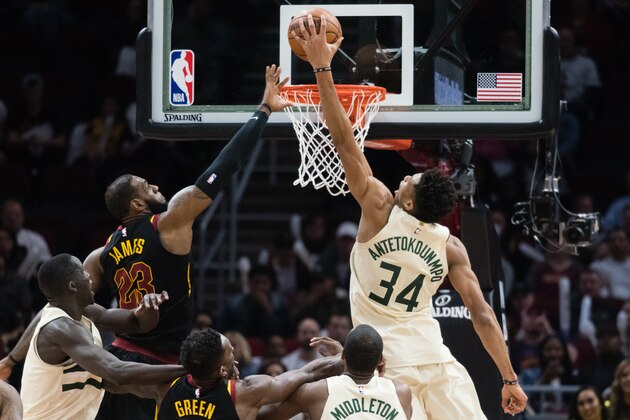 CLEVELAND, OH - MARCH 19: Giannis Antetokounmpo #34 of the Milwaukee Bucks dunks over LeBron James #23 of the Cleveland Cavaliers during the second half at Quicken Loans Arena on March 19, 2018 in Cleveland, Ohio. The Cavaliers defeated the Bucks 124-117. NOTE TO USER: User expressly acknowledges and agrees that, by downloading and or using this photograph, User is consenting to the terms and conditions of the Getty Images License Agreement. (Photo by Jason Miller/Getty Images)