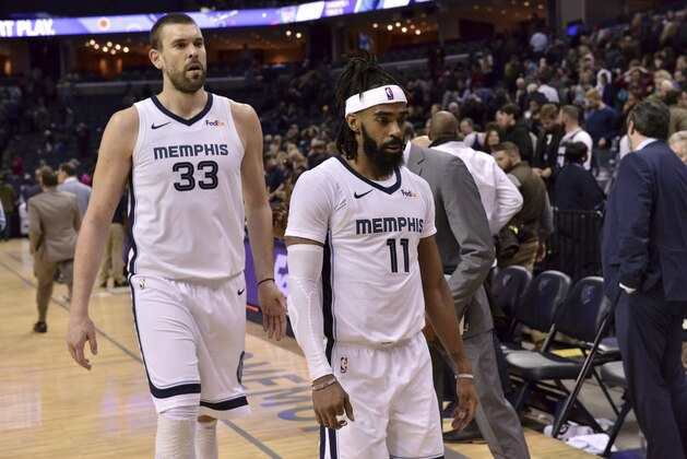 Memphis Grizzlies center Marc Gasol (33) and guard Mike Conley (11) walk off of the court after an NBA basketball game against the Sacramento Kings Friday, Jan. 25, 2019, in Memphis, Tenn. (AP Photo/Brandon Dill)