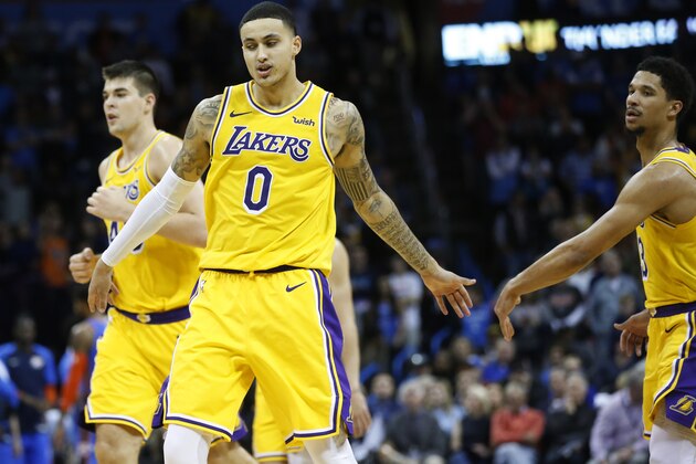 Los Angeles Lakers forward Kyle Kuzma (0) is congratulated by teammate Josh Hart during an NBA basketball game between the Los Angeles Lakers and the Oklahoma City Thunder in Oklahoma City, Thursday, Jan. 17, 2019. (AP Photo/Sue Ogrocki)