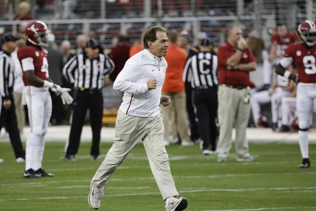 Alabama head coach Nick Saban runs across the field during warm ups before the NCAA college football playoff championship game against Clemson Monday, Jan. 7, 2019, in Santa Clara, Calif. (AP Photo/David J. Phillip)