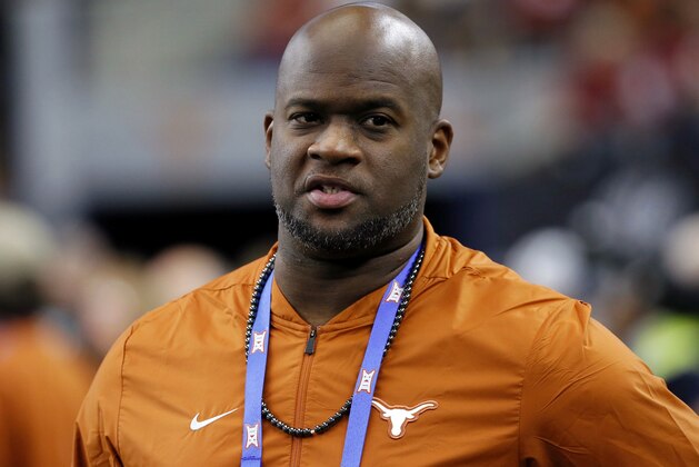 FILE - In this Dec. 1, 2018, file photo, former Texas NCAA college football quarterback Vince Young stands on the sideline during the first half of the NCAA Big 12 Conference championship against Oklahoma, in Arlington, Texas. Texas quarterback Vince Young and Notre Dame speedster Raghib Ismail have been selected, Monday, Jan. 7, 2019, for induction into the College Football Hall of Fame, along with 11 other players and two coaches. (AP Photo/Roger Steinman, File)