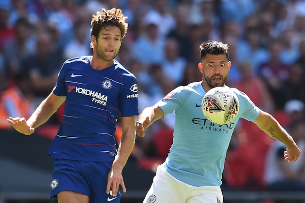 Manchester City's Argentinian striker Sergio Aguero (R) vies with Chelsea's Spanish defender Marcos Alonso during the English FA Community Shield football match between Chelsea and Manchester City at Wembley Stadium in north London on August 5, 2018. (Photo by Glyn KIRK / AFP) / NOT FOR MARKETING OR ADVERTISING USE / RESTRICTED TO EDITORIAL USE        (Photo credit should read GLYN KIRK/AFP/Getty Images)