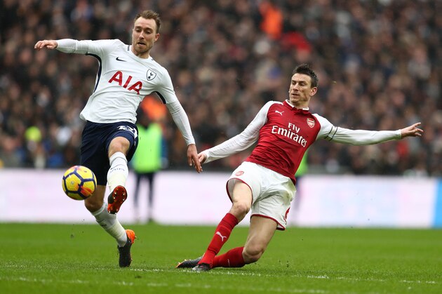 LONDON, ENGLAND - FEBRUARY 10: Christian Eriksen of Tottenham Hotspur and Laurent Koscielny of Arsenal during the Premier League match between Tottenham Hotspur and Arsenal at Wembley Stadium on February 10, 2018 in London, England. (Photo by Catherine Ivill/Getty Images)