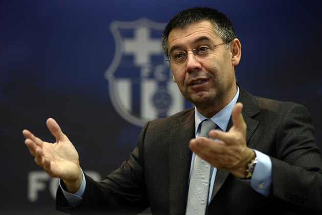 FC Barcelona's president Josep Maria Bartomeu answers to AFP journalists during an interview at Camp Nou stadium in Barcelona on March 24, 2014. Bartomeu has insisted that Lionel Messi will become the world's highest paid footballer once negotiations over his new contract are finalised.     AFP PHOTO/ LLUIS GENE        (Photo credit should read LLUIS GENE/AFP/Getty Images)