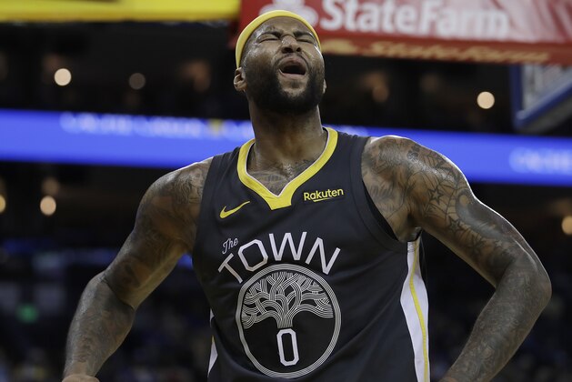 Golden State Warriors' DeMarcus Cousins celebrates a score against the San Antonio Spurs during the second half of an NBA basketball game Wednesday, Feb. 6, 2019, in Oakland, Calif. (AP Photo/Ben Margot)
