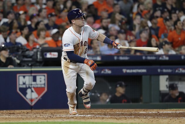 Houston Astros' Alex Bregman (2) watches his solo home run against Cleveland Indians' pitcher Trevor Bauer during the seventh inning of Game 2 of a baseball American League Division Series, Saturday, Oct. 6, 2018, in Houston. (AP Photo/David J. Phillip)