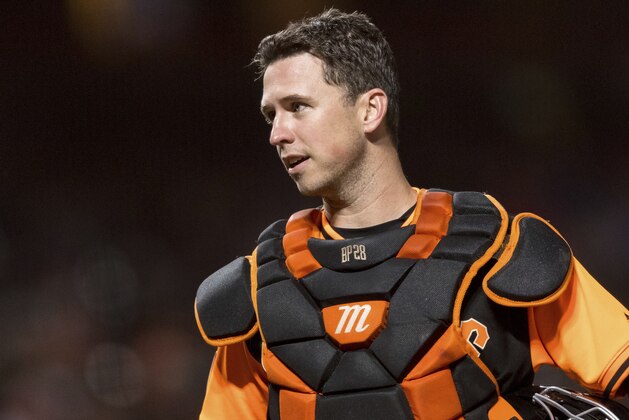 San Francisco Giants catcher Buster Posey talks to an umpire before the pitch against the Texas Rangers in the sixth inning of a baseball game in San Francisco, Friday, Aug 24, 2018. (AP Photo/John Hefti)