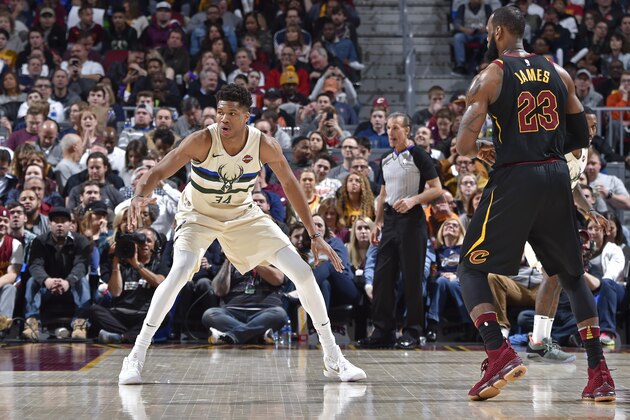 CLEVELAND, OH - MARCH 19: LeBron James #23 of the Cleveland Cavaliers handles the ball against Giannis Antetokounmpo #34 of the Milwaukee Bucks on March 19, 2018 at Quicken Loans Arena in Cleveland, Ohio.  NOTE TO USER: User expressly acknowledges and agrees that, by downloading and or using this Photograph, user is consenting to the terms and conditions of the Getty Images License Agreement. Mandatory Copyright Notice: Copyright 2018 NBAE (Photo by David Liam Kyle/NBAE via Getty Images)