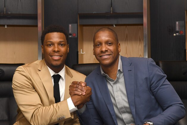 TORONTO, CANADA - JUNE 7:  Kyle Lowry #7 and President of the Toronto Raptors, Masai Ujiri announce his re-signing during a press conference on June 7, 2017 at the Air Canada Centre in Toronto, Ontario, Canada. NOTE TO USER: User expressly acknowledges and agrees that, by downloading and or using this Photograph, user is consenting to the terms and conditions of the Getty Images License Agreement.  Mandatory Copyright Notice: Copyright 2017 NBAE (Photo by Ron Turenne/NBAE via Getty Images)