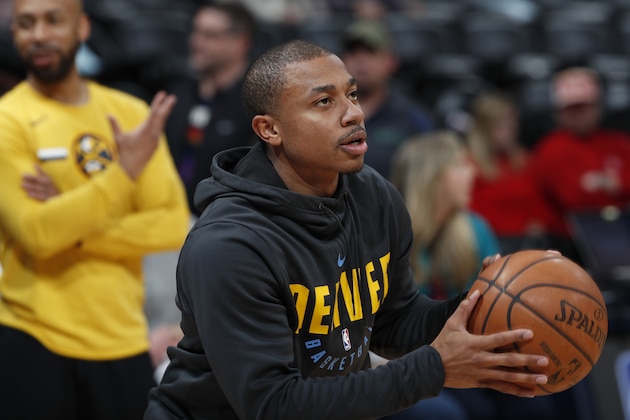 Injured Denver Nuggets guard Isaiah Thomas practices before the team's NBA basketball game against the Houston Rockets on Friday, Feb. 1, 2019, in Denver. (AP Photo/David Zalubowski)