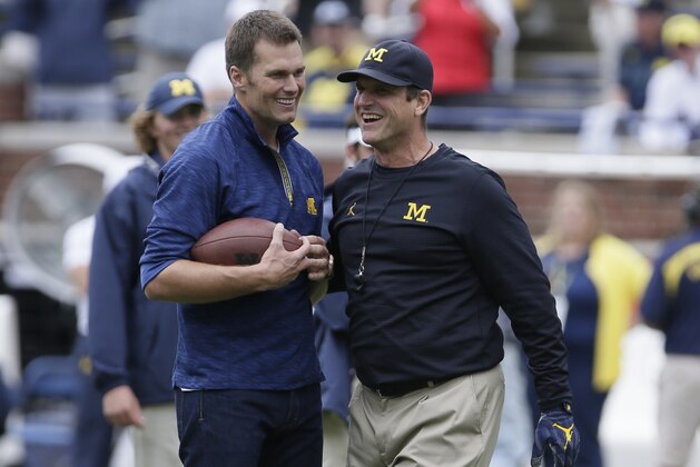 ANN ARBOR, MI - SEPTEMBER 17:  Quarterback Tom Brady of the New England Patriots laughs with head coach Jim Harbaugh of the Michigan Wolverines after they played catch before a game against the Colorado Buffaloes at Michigan Stadium on September 17, 2016 in Ann Arbor, Michigan. (Photo by Duane Burleson/Getty Images)