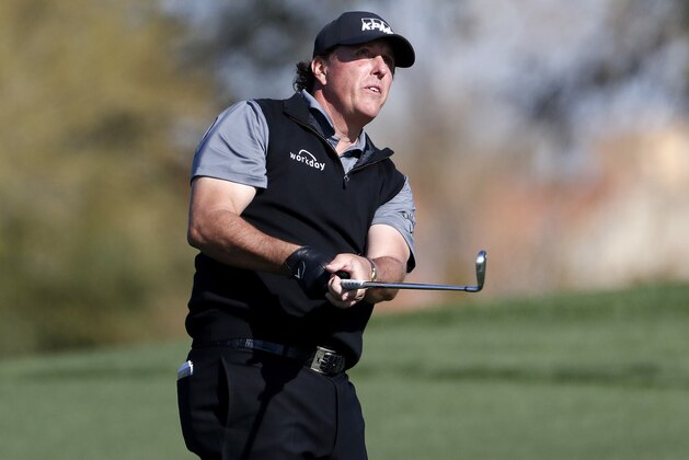 Phil Mickelson hits from the second fairway during the second round of the Phoenix Open PGA golf tournament, Friday, Feb. 1, 2019, in Scottsdale, Ariz. (AP Photo/Matt York)