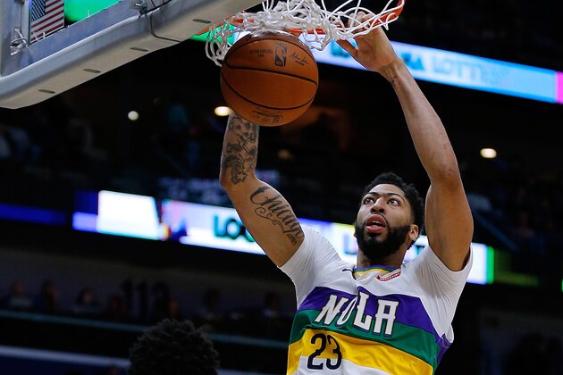 NEW ORLEANS, LOUISIANA - FEBRUARY 08: Anthony Davis #23 of the New Orleans Pelicans dunks over Karl-Anthony Towns #32 of the Minnesota Timberwolves during the first half at the Smoothie King Center on February 08, 2019 in New Orleans, Louisiana. NOTE TO USER: User expressly acknowledges and agrees that, by downloading and or using this photograph, User is consenting to the terms and conditions of the Getty Images License Agreement. (Photo by Jonathan Bachman/Getty Images)