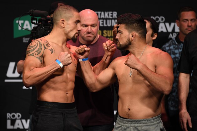 MELBOURNE, AUSTRALIA - FEBRUARY 09:  (L-R) Robert Whittaker of Australia and Kelvin Gastelum face off during the UFC 234 weigh-in at Rod Laver Arena on February 09, 2019 in the Melbourne Australia. (Photo by Jeff Bottari/Zuffa LLC/Zuffa LLC via Getty Images)