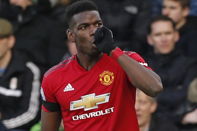 Manchester United's French midfielder Paul Pogba celebrates after scoring the opening goal of the English Premier League football match between Fulham and Manchester United at Craven Cottage in London on February 9, 2019. (Photo by Ian KINGTON / AFP) / RESTRICTED TO EDITORIAL USE. No use with unauthorized audio, video, data, fixture lists, club/league logos or 'live' services. Online in-match use limited to 120 images. An additional 40 images may be used in extra time. No video emulation. Social media in-match use limited to 120 images. An additional 40 images may be used in extra time. No use in betting publications, games or single club/league/player publications. /         (Photo credit should read IAN KINGTON/AFP/Getty Images)