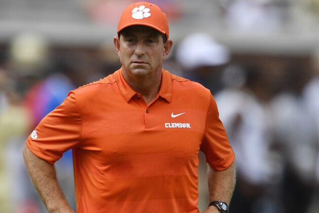 Clemson head coach Dabo Swinney watches teams warm up before the first half of an NCAA college football game between Georgia Tech and Clemson, Saturday, Sept. 22, 2018, in Atlanta. (AP Photo/Mike Stewart)