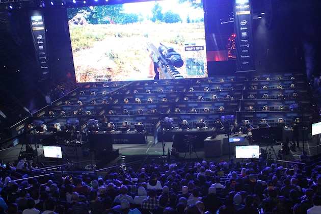 Fans watch as 80 players simultaneously fight for survival in an eSports match of upstart computer game PlayUnknown's Battlegrounds at an Intel Extreme Masters tournament in the Oracle Arena in Oakland, California on November 18, 2017.
Scores of virtual warriors faced-off in a Hunger Games-style death match here in a massive, real-world eSports match-up of upstart shooter game 'PlayerUnknown's Battlegrounds.' The computer game's rise has been epic, with some industry trackers branding this the year of 'PUBG' even though it is technically still in trial mode with a final version yet to be released.In a colossal  two-day event that ended late Sunday, 80 players hunched over computers in a warren of cubicles set up in an arena where the champion Golden State Warriors usually play home basketball games.
 / AFP PHOTO / Glenn CHAPMAN        (Photo credit should read GLENN CHAPMAN/AFP/Getty Images)