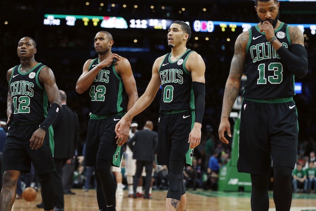 Boston Celtics' Terry Rozier (12), Al Horford (42), Jayson Tatum (0) and Marcus Morris (13) walk to the bench during a timeout in the second half of the team's NBA basketball game against the Los Angeles Clippers in Boston, Saturday, Feb. 9, 2019. (AP Photo/Michael Dwyer)