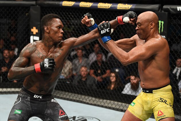MELBOURNE, AUSTRALIA - FEBRUARY 10:  (L-R) Israel Adesanya of New Zealand punches Anderson Silva of Brazil in their middleweight bout during the UFC 234 at Rod Laver Arena on February 10, 2019 in the Melbourne, Australia. (Photo by Jeff Bottari/Zuffa LLC/Zuffa LLC via Getty Images)