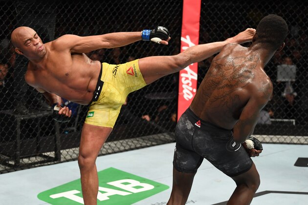 MELBOURNE, AUSTRALIA - FEBRUARY 10:  (L-R) Anderson Silva of Brazil kicks Israel Adesanya of New Zealand in their middleweight bout during the UFC 234 at Rod Laver Arena on February 10, 2019 in the Melbourne, Australia. (Photo by Jeff Bottari/Zuffa LLC/Zuffa LLC via Getty Images)