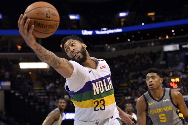New Orleans Pelicans forward Anthony Davis (23) reaches for the ball ahead of Memphis Grizzlies forward Bruno Caboclo (5) during the first half of an NBA basketball game Saturday, Feb. 9, 2019, in Memphis, Tenn. (AP Photo/Brandon Dill)