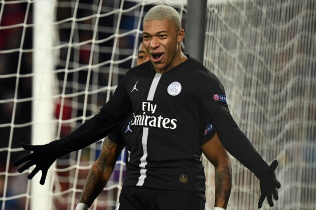 Paris Saint-Germain's French forward Kylian Mbappe celebrates his team's opening goal during the European Champions League football match Crvena Zvezda Belgrade vs Paris Saint-Germain (PSG) on December 11, 2018 at Rajko-Mitic stadium in Belgarde. (Photo by FRANCK FIFE / AFP)        (Photo credit should read FRANCK FIFE/AFP/Getty Images)