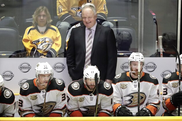 Anaheim Ducks head coach Randy Carlyle watches the action in the third period of an NHL hockey game between the Ducks and the Nashville Predators Sunday, Nov. 25, 2018, in Nashville, Tenn. The Predators won 5-2. (AP Photo/Mark Humphrey)