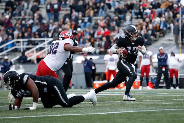 BIRMINGHAM, ALABAMA - FEBRUARY 10:  Luis Perez #12 of Birmingham Iron avoids a tackle by Julius Warmsley #92 of Memphis Express during an Alliance of American Football game at Legion Field on February 10, 2019 in Birmingham, Alabama. (Photo by Joe Robbins/AAF/Getty Images)