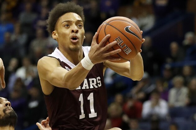 Missouri State's Jarred Dixon (11) heads to the basket past Northern Iowa's Jeremy Morgan during the second half of an NCAA college basketball game in the quarterfinals of the Missouri Valley Conference men's tournament Friday, March 3, 2017, in St. Louis. Missouri State won 70-64. (AP Photo/Jeff Roberson)