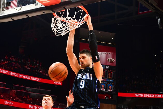 ATLANTA, GA - FEBRUARY 10: Nikola Vucevic #9 of the Orlando Magic dunks against the Atlanta Hawks on February 10, 2019 at State Farm Arena in Atlanta, Georgia.  NOTE TO USER: User expressly acknowledges and agrees that, by downloading and/or using this Photograph, user is consenting to the terms and conditions of the Getty Images License Agreement. Mandatory Copyright Notice: Copyright 2019 NBAE (Photo by Scott Cunningham/NBAE via Getty Images)