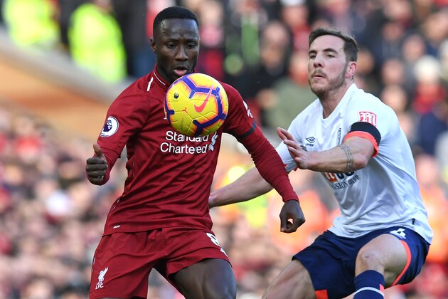 Liverpool's Guinean midfielder Naby Keita (L) vies with Bournemouth's English midfielder Dan Gosling (R) during the English Premier League football match between Liverpool and Bournemouth at Anfield in Liverpool, north west England on February 9, 2019. (Photo by Paul ELLIS / AFP) / RESTRICTED TO EDITORIAL USE. No use with unauthorized audio, video, data, fixture lists, club/league logos or 'live' services. Online in-match use limited to 120 images. An additional 40 images may be used in extra time. No video emulation. Social media in-match use limited to 120 images. An additional 40 images may be used in extra time. No use in betting publications, games or single club/league/player publications. /         (Photo credit should read PAUL ELLIS/AFP/Getty Images)