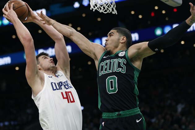 Los Angeles Clippers' Ivica Zubac (40) shoots against Boston Celtics' Jayson Tatum (0) during the second half of an NBA basketball game in Boston, Saturday, Feb. 9, 2019. (AP Photo/Michael Dwyer)