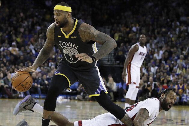 Golden State Warriors' DeMarcus Cousins (0) drives past Miami Heat forward James Johnson during the second half of an NBA basketball game, Sunday, Feb. 10, 2019, in Oakland, Calif. (AP Photo/Ben Margot)