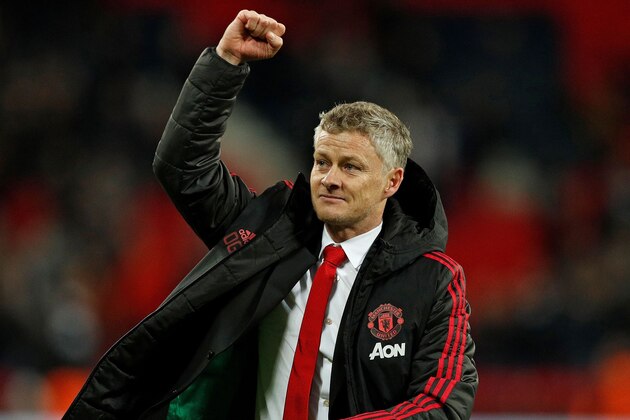 Manchester United's  Norwegian caretaker manager Ole Gunnar Solskjaer applauds the fans following the English Premier League football match between Tottenham Hotspur and Manchester United at Wembley Stadium in London, on January 13, 2019. - Manchester United won 1-0. (Photo by Adrian DENNIS / AFP) / RESTRICTED TO EDITORIAL USE. No use with unauthorized audio, video, data, fixture lists, club/league logos or 'live' services. Online in-match use limited to 120 images. An additional 40 images may be used in extra time. No video emulation. Social media in-match use limited to 120 images. An additional 40 images may be used in extra time. No use in betting publications, games or single club/league/player publications. /         (Photo credit should read ADRIAN DENNIS/AFP/Getty Images)