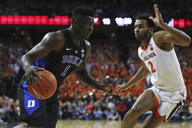 Duke forward Zion Williamson (1) drives past Virginia's guard Braxton Key during the first half of an NCAA college basketball game Saturday, Feb. 9, 2018, in Charlottesville, Va. (AP Photo/Zack Wajsgras)
