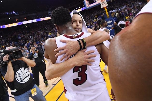 OAKLAND, CA - FEBRUARY 10: Stephen Curry #30 of the Golden State Warriors hugs Dwyane Wade #3 of the Miami Heat after the game on February 10 at ORACLE Arena in Oakland, California. NOTE TO USER: User expressly acknowledges and agrees that, by downloading and or using this photograph, user is consenting to the terms and conditions of Getty Images License Agreement. Mandatory Copyright Notice: Copyright 2019 NBAE (Photo by Noah Graham/NBAE via Getty Images)