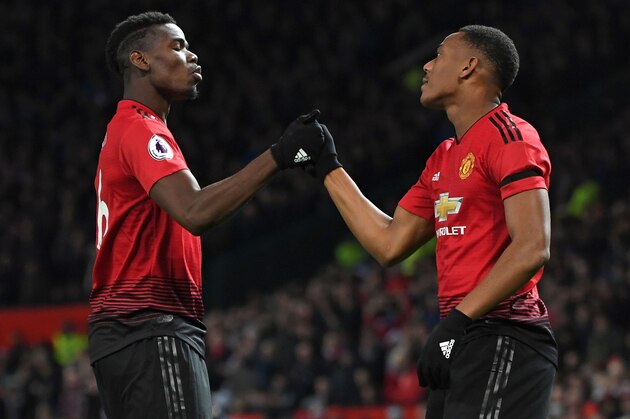 Manchester United's French striker Anthony Martial celebrates with Manchester United's French midfielder Paul Pogba (L) after scoring their second goal during the English Premier League football match between Manchester United and Everton at Old Trafford in Manchester, north west England, on October 28, 2018. (Photo by Paul ELLIS / AFP) / RESTRICTED TO EDITORIAL USE. No use with unauthorized audio, video, data, fixture lists, club/league logos or 'live' services. Online in-match use limited to 120 images. An additional 40 images may be used in extra time. No video emulation. Social media in-match use limited to 120 images. An additional 40 images may be used in extra time. No use in betting publications, games or single club/league/player publications. /         (Photo credit should read PAUL ELLIS/AFP/Getty Images)