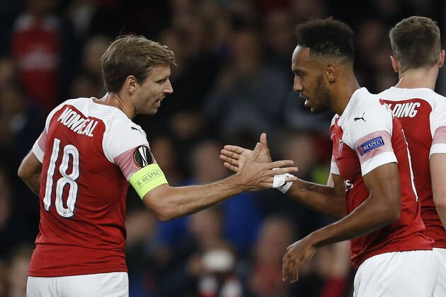 Arsenal's Gabonese striker Pierre-Emerick Aubameyang (R) celebrates with Arsenal's Spanish defender Nacho Monreal after scoring his team's first goal during the UEFA Europa League group E football match between Arsenal and Vorskla Poltava at the Emirates Stadium in London on September 20, 2018. (Photo by Ian KINGTON / AFP)        (Photo credit should read IAN KINGTON/AFP/Getty Images)