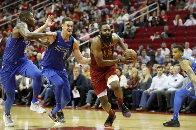 HOUSTON, TX - FEBRUARY 11:  James Harden #13 of the Houston Rockets drives to the basket defended by Dwight Powell #7 of the Dallas Mavericks in the first half at Toyota Center on February 11, 2019 in Houston, Texas.  NOTE TO USER: User expressly acknowledges and agrees that, by downloading and or using this photograph, User is consenting to the terms and conditions of the Getty Images License Agreement.  (Photo by Tim Warner/Getty Images)