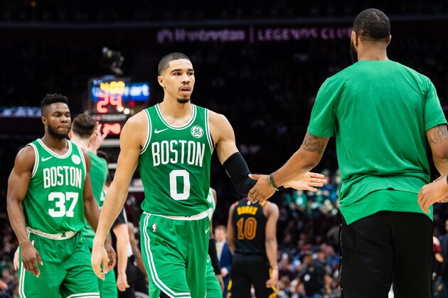 CLEVELAND, OH - FEBRUARY 5: Jayson Tatum #0 celebrates with Marcus Morris #13 of the Boston Celtics during a timeout during the second half against the Cleveland Cavaliers at Quicken Loans Arena on February 5, 2019 in Cleveland, Ohio. The Celtics defeated the Cavaliers 103-96. NOTE TO USER: User expressly acknowledges and agrees that, by downloading and/or using this photograph, user is consenting to the terms and conditions of the Getty Images License Agreement. (Photo by Jason Miller/Getty Images)