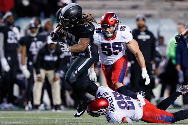 BIRMINGHAM, ALABAMA - FEBRUARY 10:  Trent Richardson #33 of the Birmingham Iron is tripped up by Arnold Tarpley, III #25 of Memphis Express during an Alliance of American Football game at Legion Field on February 10, 2019 in Birmingham, Alabama. (Photo by Kevin C. Cox/AAF/Getty Images)
