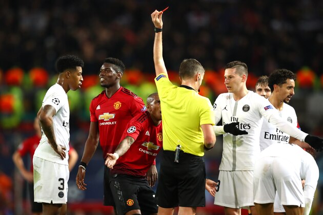 MANCHESTER, ENGLAND - FEBRUARY 12: Paul Pogba of Manchester United is shown a red card during the UEFA Champions League Round of 16 First Leg match between Manchester United and Paris Saint-Germain at Old Trafford on February 12, 2019 in Manchester, England. (Photo by Michael Steele/Getty Images)